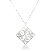 Load image into Gallery viewer, A view of our Square Spiral Medallion hanging head-on over a white background. Inspired by our Square Spiral Earrings, this rather large medallion features a square spiral motif in a repeating pattern, designed with perfect angles at every turn. As about 60mm square, this is a BIG statement piece, but designed to remain lighter than it looks. Hanging from a 22 inch 1.5mm sterling silver Italian box chain, this piece is elegant, powerful, and sure to make a statement.