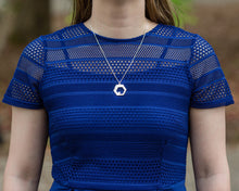 Load image into Gallery viewer, A model in a blue lace-top shirt wears a Hextech Necklace. The model's face is not visible.
