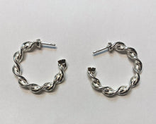 Load image into Gallery viewer, A pair of Hexspiral Hoop Earrings lie on a white surface. 
