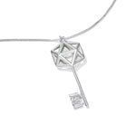 An image of the D20 Key Necklace over a white background The sterling silver D20 Key Necklace is a gaming-inspired design, matching well with our D20 earrings. The icosahedron at the top of the key is a flattened design for additional comfort, and the wards of the key feature a small D20 silhouette. This piece definitely makes the statement that you're ready for game night.