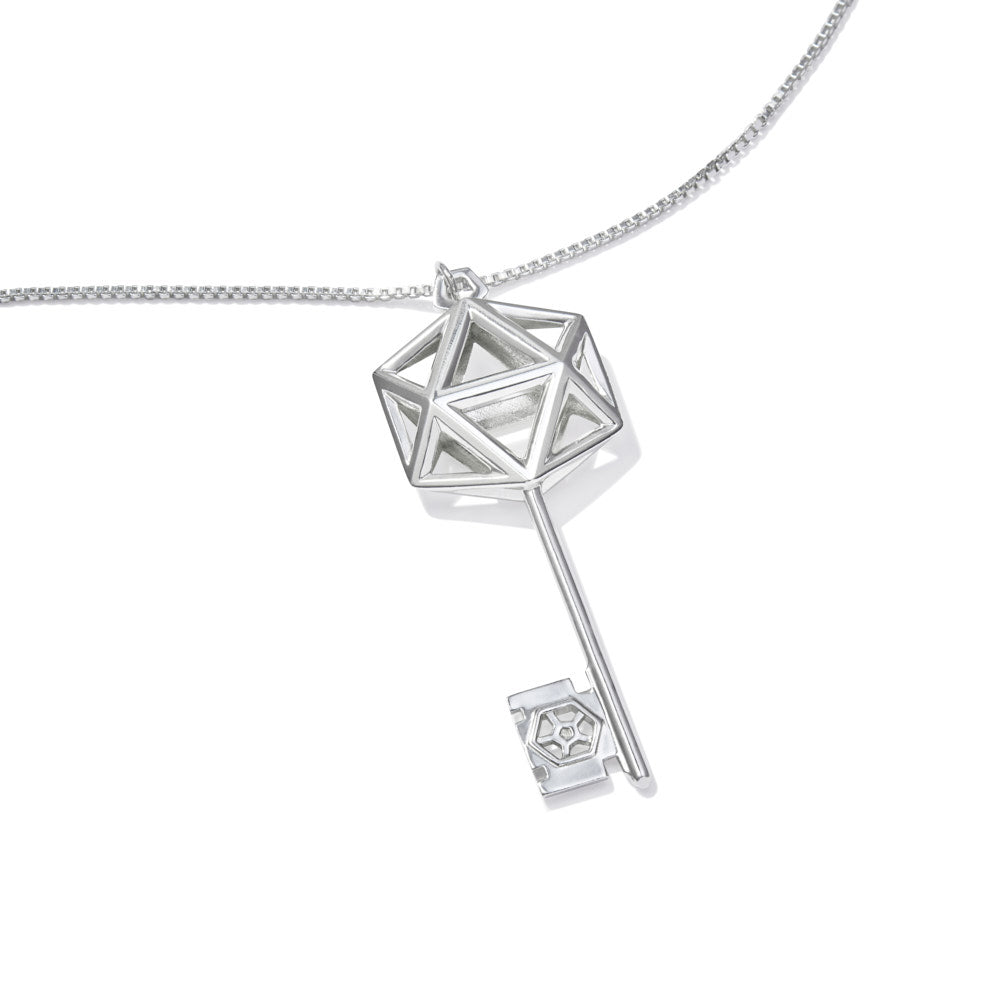 An image of the D20 Key Necklace over a white background The sterling silver D20 Key Necklace is a gaming-inspired design, matching well with our D20 earrings. The icosahedron at the top of the key is a flattened design for additional comfort, and the wards of the key feature a small D20 silhouette. This piece definitely makes the statement that you're ready for game night.