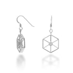 An image of the Facet Earrings, which are exterior hexagons measuring 21mm in diameter and 4mm wide, each edge with an alternating flat side and windowed side to see into the interior through the edges. The interior has a solid hexagon supported by 12 supports radiating to the corners. At the top of each is a hexagonal bail, and these come suspended from hypoallergenic Argentium silver hooks for added comfort and exceptional tarnish resistance. 