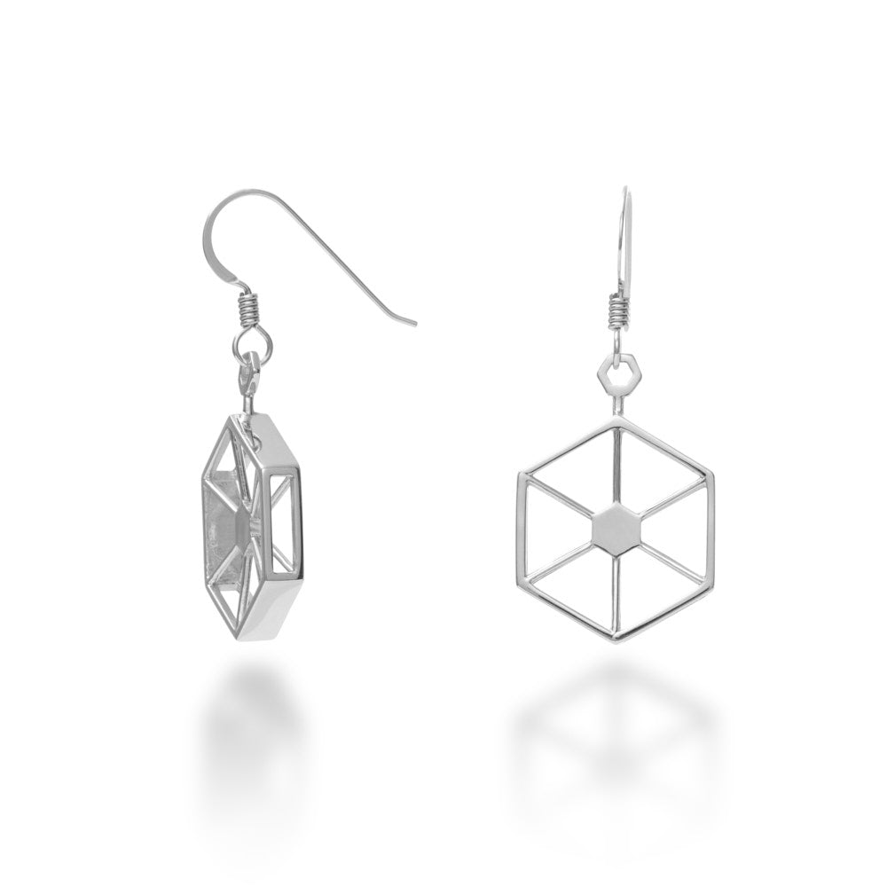 An image of the Facet Earrings, which are exterior hexagons measuring 21mm in diameter and 4mm wide, each edge with an alternating flat side and windowed side to see into the interior through the edges. The interior has a solid hexagon supported by 12 supports radiating to the corners. At the top of each is a hexagonal bail, and these come suspended from hypoallergenic Argentium silver hooks for added comfort and exceptional tarnish resistance. 