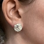 A closeup of a model's right ear wearing a Geode Earring