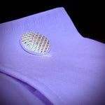 A closeup photo of our Diamond Pattern Cufflinks on a purple shirt cuff.