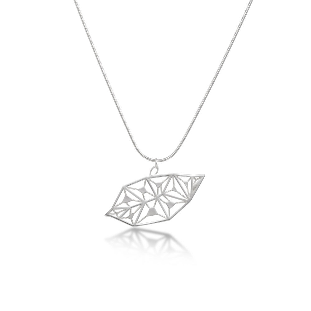 An image of the LīF Necklace, hanging against a white background, showing the angle at which it's designed to hang. 