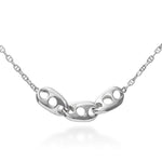 An image of the Seafarer Necklace hanging in front of a white background. The necklace is a stylised vision of the classic marine chain design. With three large, heavy links of sold sterling silver, hanging inline along a more traditional marine chain, this design's simplicity belies its elegance. Three large, solid, twisted links in the center, joined together form a sturdy, rugged chain that still somehow manages to be elegantly refined in its design. 