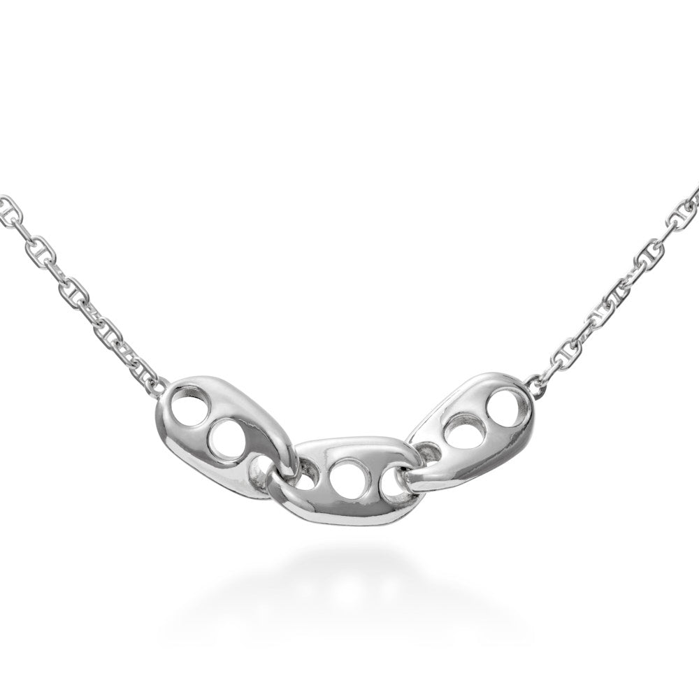 An image of the Seafarer Necklace hanging in front of a white background. The necklace is a stylised vision of the classic marine chain design. With three large, heavy links of sold sterling silver, hanging inline along a more traditional marine chain, this design's simplicity belies its elegance. Three large, solid, twisted links in the center, joined together form a sturdy, rugged chain that still somehow manages to be elegantly refined in its design. 