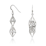 A photo of the Twisted Fractal Earrings. These earrings are a twist of sterling silver scaffolding, built around a central twisted hexagonal shape. They come to point at the top and the bottom, and their triangular bails hang from Argentium hooks added comfort and exceptional tarnish resistance. Each piece twists and sparkles in the light, at once both casual and elegant. 