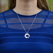 Load image into Gallery viewer, A model in a blue lace-top shirt wears a Hextech Necklace. The model&#39;s face is not visible. This is a close up shot of the necklace.
