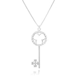An image of the Celtic Key Necklace hanging in front of a white background. The sterling silver Celtic Key Necklace has a bow comprised of a twisted sterling pattern surrounding a classic shamrock design, and a Celtic cross bit and wards. There's a Celtic knot design engraved into the bit and wards to finish off the motif. In very Montgomery-Ramsay fashion, the bail of the necklace has an inset hexagonal design for that small added hallmark detail. 