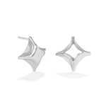 A photo of our Folded Square stud earrings against a white background. The earrings are a classic folded square design done in sterling silver and the stud is on one of the points.