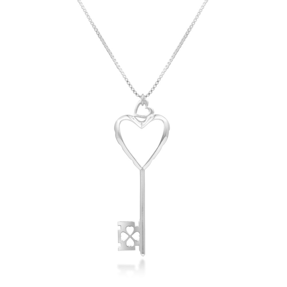 A Heart of Hearts Key Necklace hangs in front of a white background. The sterling silver key features an elegant heart shape with thickened edges, heart-shaped windows, and is topped with a heart-shaped bail. The wards are also hearts. 