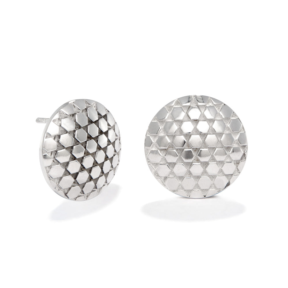 A product photo of the Beehive Earrings against a white background. The earrings are 18mm round stud earring made up of hexagons connected at the points (with triangular spaces in between). The earrings thicken toward the center in a shallow dome. 