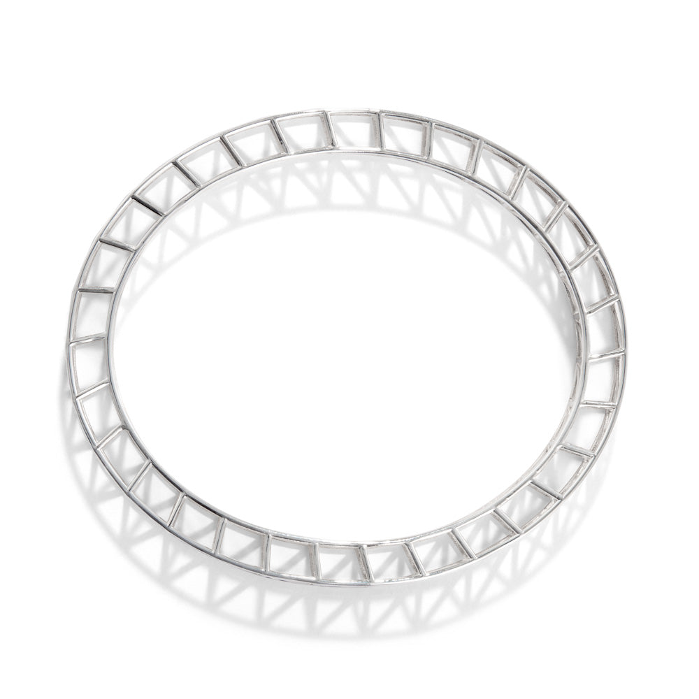 A product photo of our scaffold bangle, seen from a directly overhead. The bangle itself is a scaffolding design, with two rows of supported structures joined together in an ellipse. 
