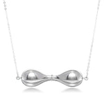 A photo of our sterling silver Tri-Curve Necklace hanging in front of a white background. The necklace is a combination of three thick silver curves, joined together at the ends and at the center. There are spaces matching the curve shape in between each curve. It hangs inline on a cable necklace. 